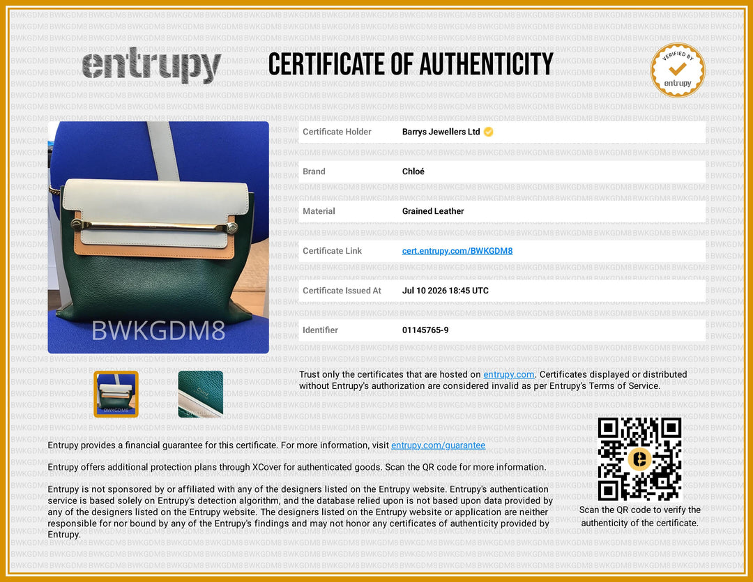 A certificate of authenticity document for Barrys Jewellers Ltd, featuring a blue and black leather roller tool, a small leather sample swatch, and a QR code on a white and gold background. The brand 'Entrupy' is clearly visible at the top.