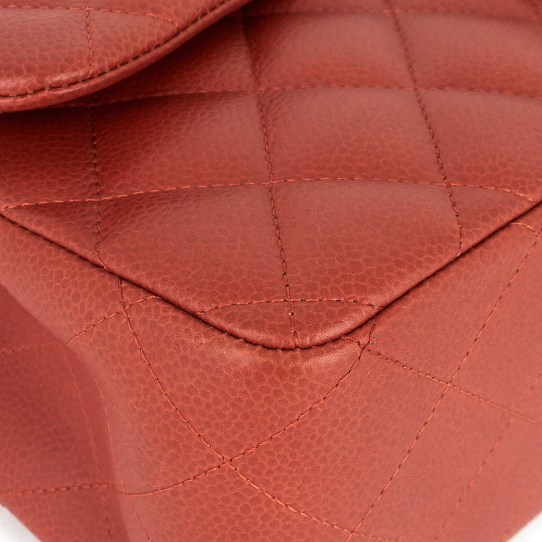 Close-up of a red quilted leather bag