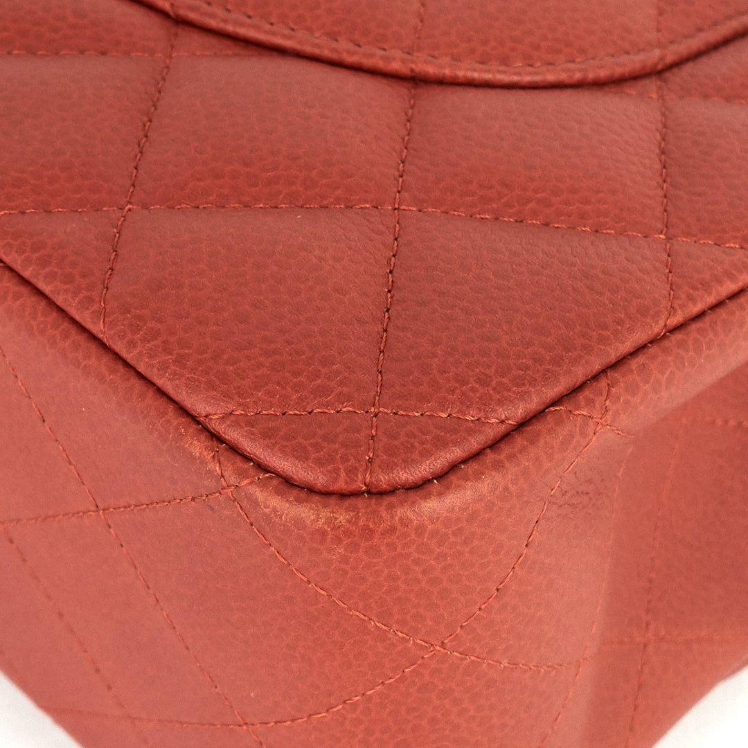 Close-up of a red quilted leather handbag