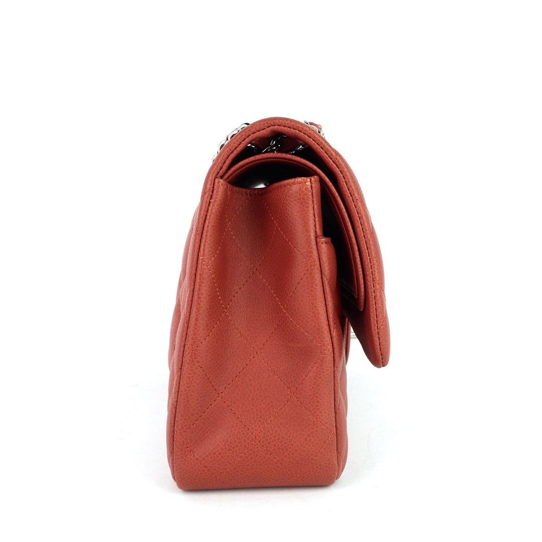 Brown handbag with a textured surface on a white background