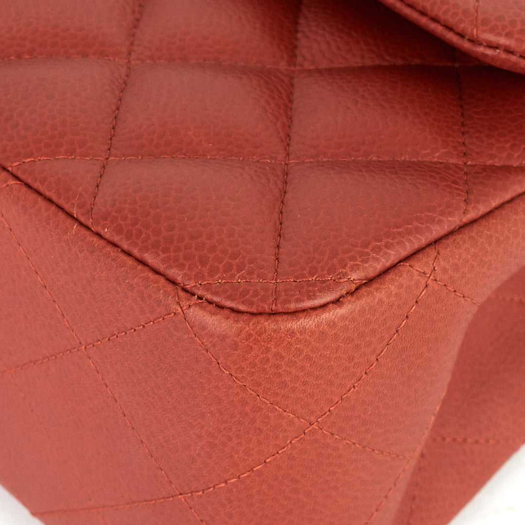 Close-up of a red quilted leather bag
