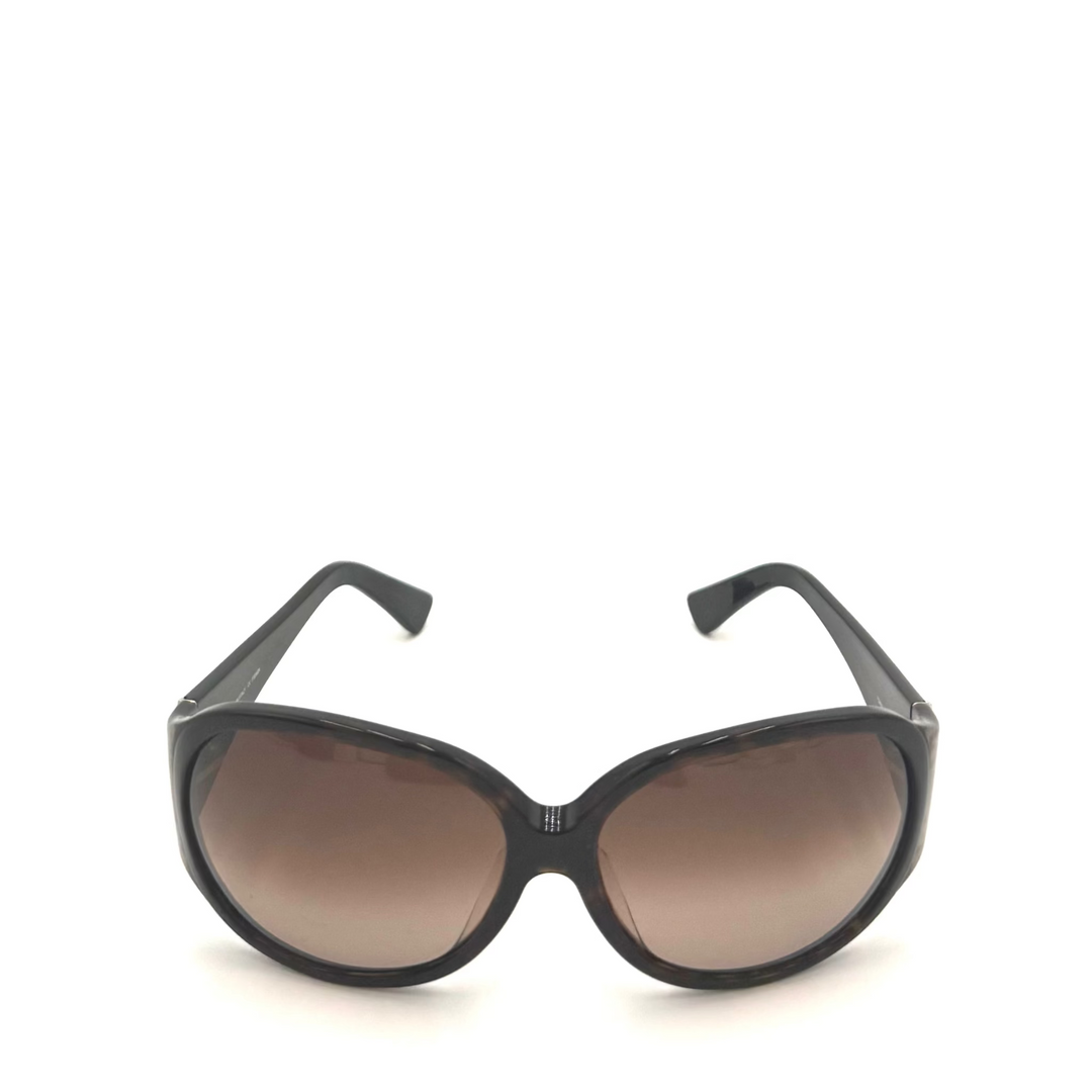 Black cat-eye sunglasses with brown gradient lenses, shown from the front on a white background.