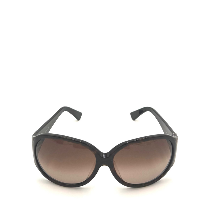 Black cat-eye sunglasses with brown gradient lenses, shown from the front on a white background.