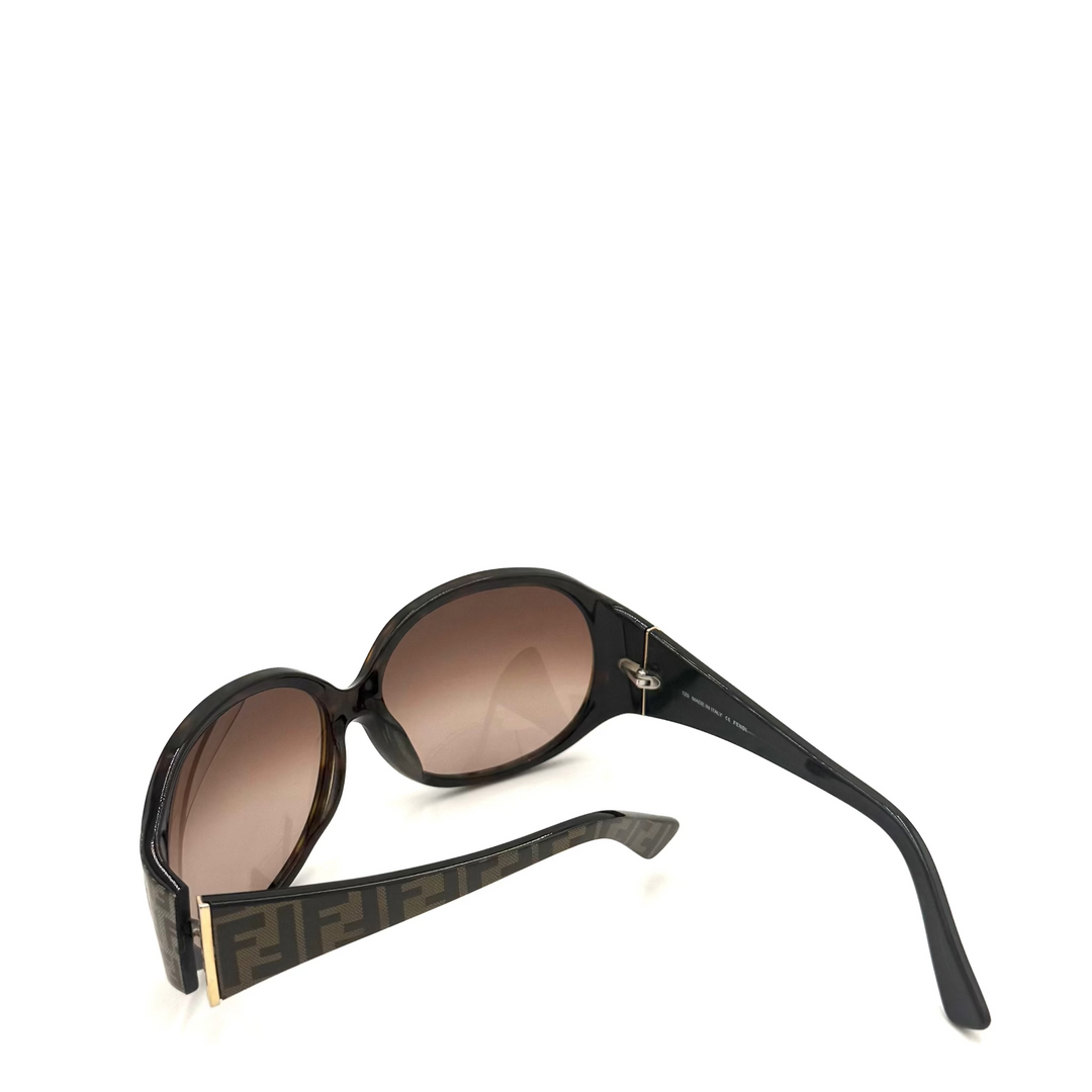 Fendi FF sunglasses with a black acetate frame, brown gradient lenses, and the signature FF monogram pattern on the temple arms.