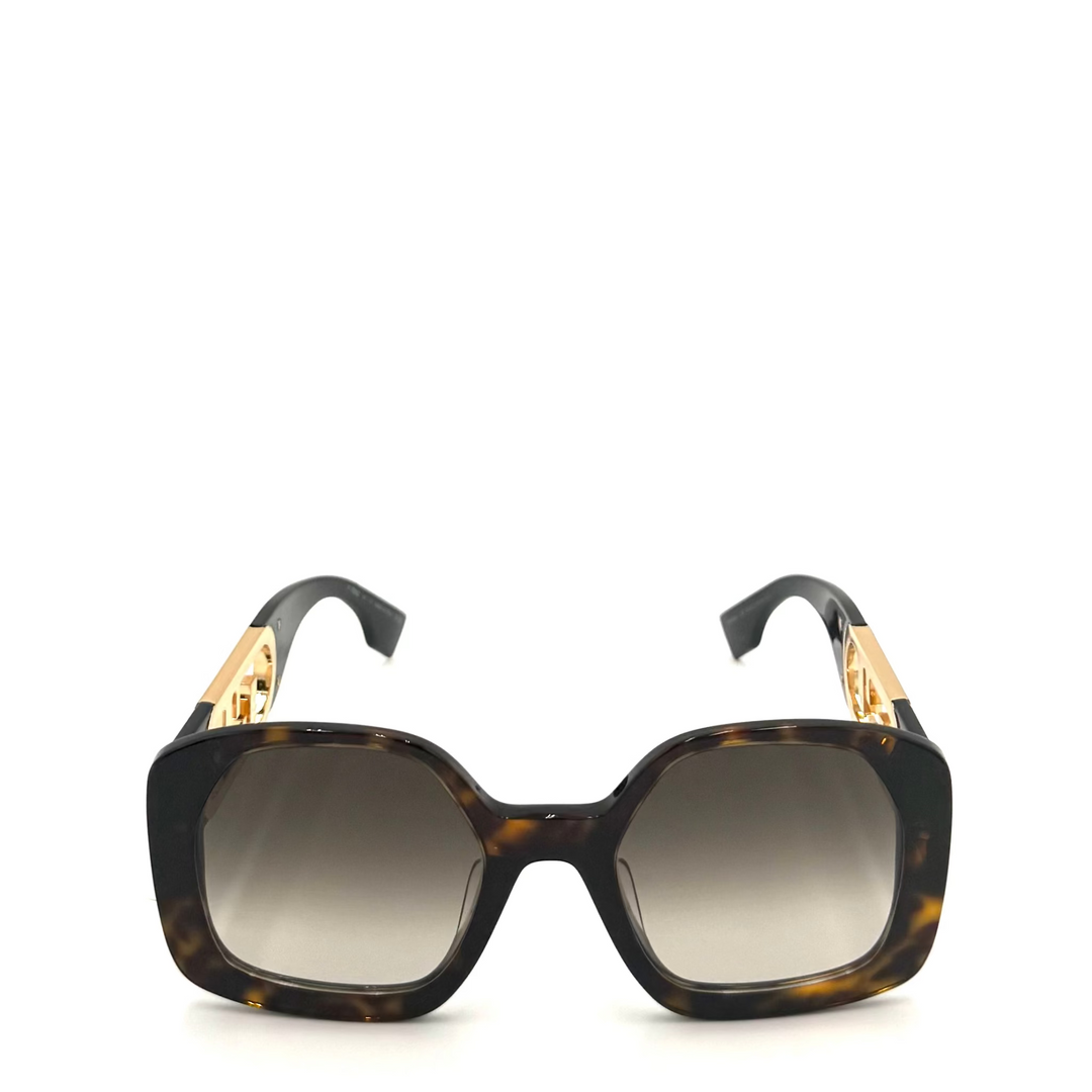 Square sunglasses with a dark brown and black tortoiseshell acetate frame, gradient gray lenses, and gold-tone metal accents on the temples, shown against a plain white background.