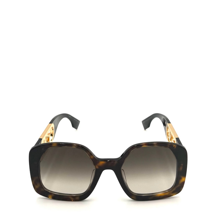 Square sunglasses with a dark brown and black tortoiseshell acetate frame, gradient gray lenses, and gold-tone metal accents on the temples, shown against a plain white background.