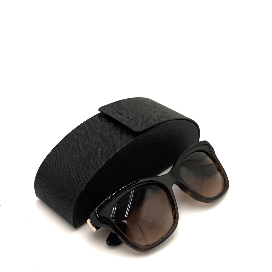 Black cat-eye sunglasses with dark lenses and a matching black textured case, photographed on a white background.