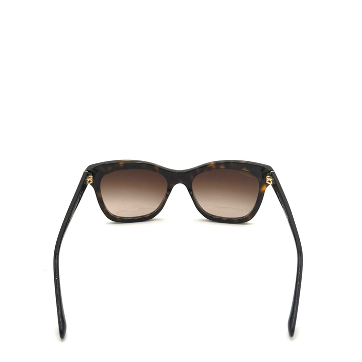 A pair of square-frame sunglasses with dark brown gradient lenses and black temples, photographed from the back against a bright white background.