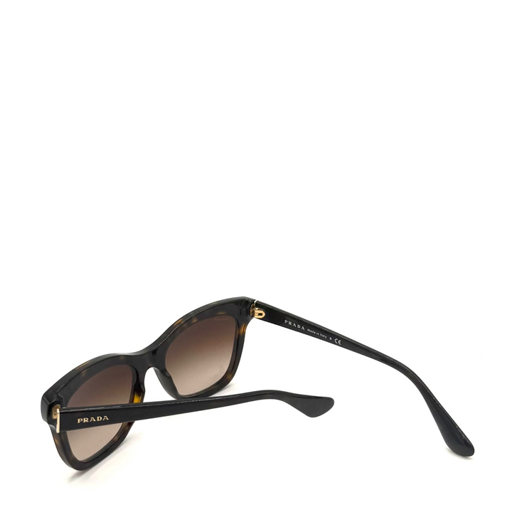 Prada sunglasses with a black tortoiseshell frame and brown gradient lenses, shown on a clean white background.