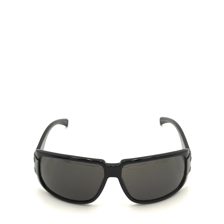 Black wrap-around sunglasses with dark tinted lenses, shown from the front on a white background.