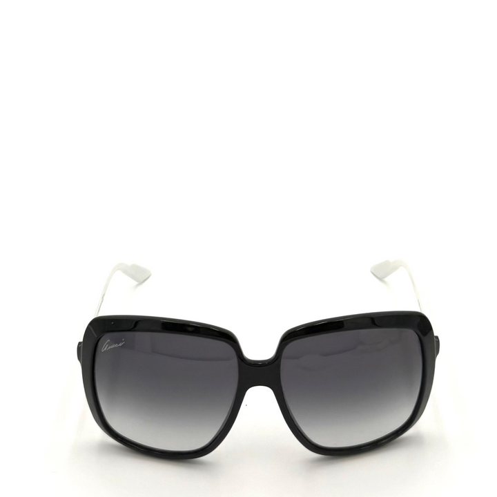 Black square sunglasses with gradient gray lenses and white temple tips, shown against a plain white background.