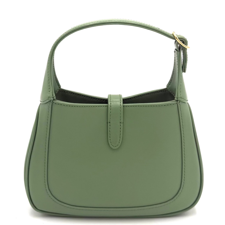 A sage green leather shoulder bag with a top handle and a small front strap detail, shown against a plain white background.