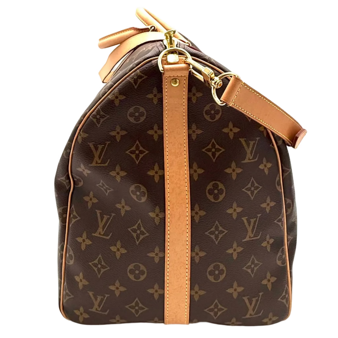 Louis Vuitton monogram canvas Speedy bag in dark brown with tan leather trim and strap, featuring gold-tone hardware on a white background.