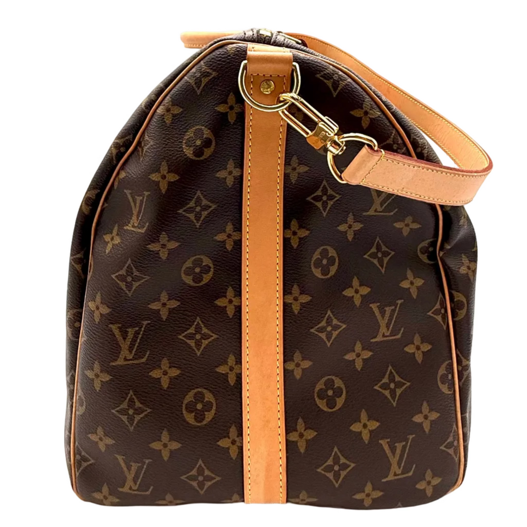 Louis Vuitton monogram canvas shoulder bag in dark brown with tan leather trim and gold-tone hardware, shown against a plain white background.