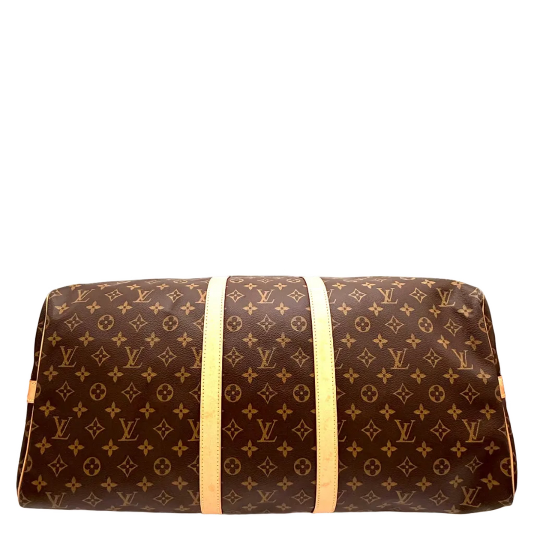 A Louis Vuitton monogram canvas duffel bag with light tan leather trim, shown against a plain white background.