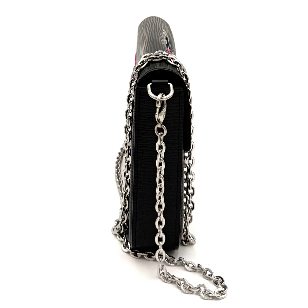A black leather shoulder bag with silver chain detailing and a silver metal top handle, shown from a side profile on a white background.