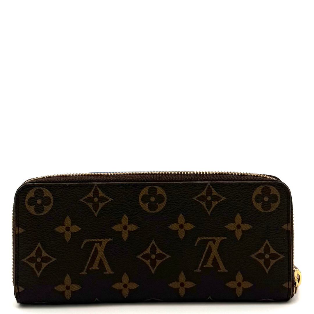A Louis Vuitton monogram zip-around wallet in dark brown coated canvas with gold-tone hardware, photographed against a plain white background.