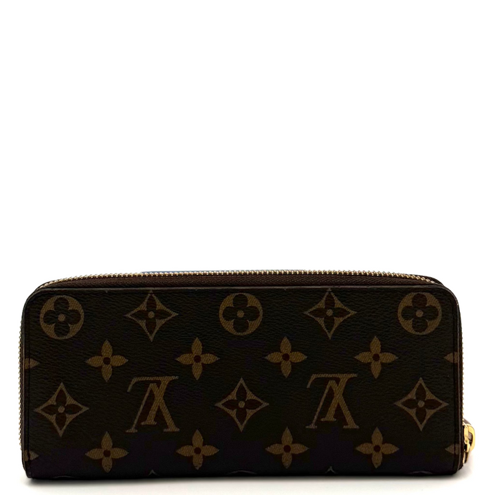 A Louis Vuitton monogram zip-around wallet in dark brown coated canvas with gold-tone hardware, photographed against a plain white background.