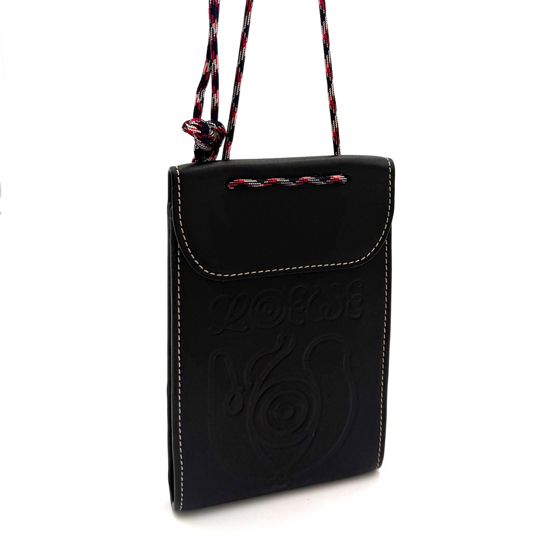 A black leather crossbody phone bag with a braided red and black strap, featuring an embossed spiral design on the front flap.